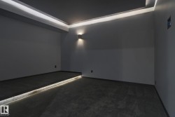Carpeted cinema featuring baseboards - 