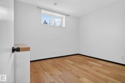 Spare room with light wood-style floors and baseboards - 