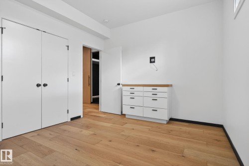 Unfurnished bedroom featuring a closet and light wood finished floors - 104 Edgewater Circle, Leduc, AB - Indoor Photo Showing Other Room