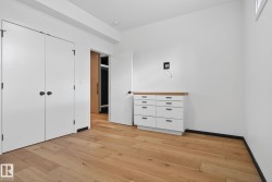 Unfurnished bedroom featuring a closet and light wood finished floors - 