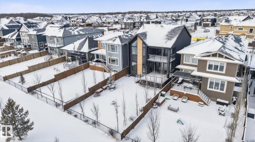 Snowy aerial view featuring a residential view - 104 Edgewater Circle, Leduc, AB - Outdoor