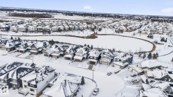 Snowy aerial view featuring a residential view - 