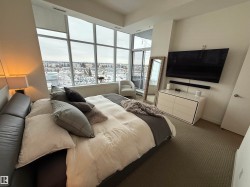 Bedroom featuring carpet flooring and baseboards - 