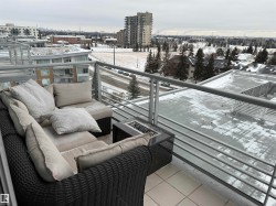 View of snow covered back of property - 
