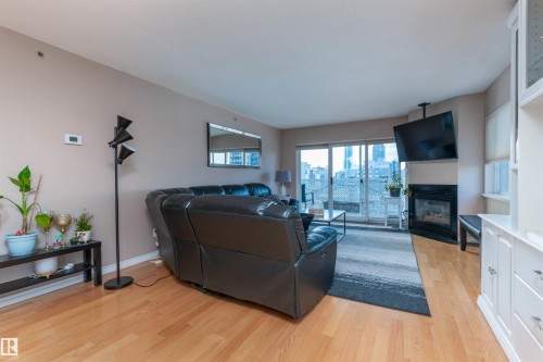 1105 10130 114 Street, Edmonton, AB - Indoor Photo Showing Living Room With Fireplace