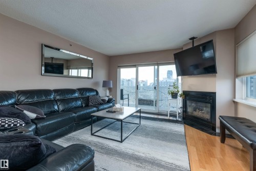 1105 10130 114 Street, Edmonton, AB - Indoor Photo Showing Living Room With Fireplace