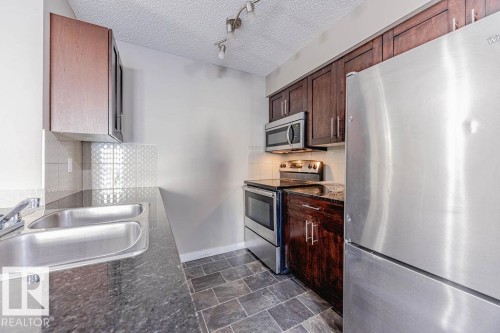 202 5816 Mullen Place, Edmonton, AB - Indoor Photo Showing Kitchen With Stainless Steel Kitchen With Double Sink