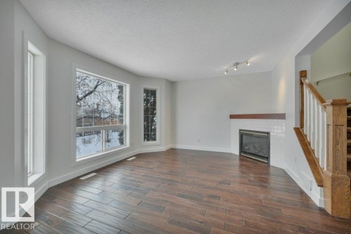 11 Campbell Court, Leduc, AB - Indoor Photo Showing Living Room With Fireplace