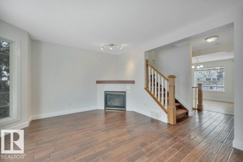 11 Campbell Court, Leduc, AB - Indoor Photo Showing Living Room With Fireplace