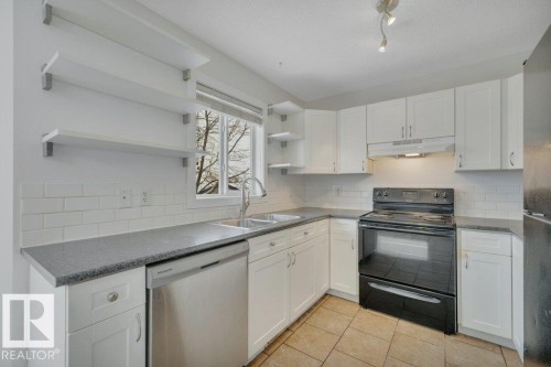 11 Campbell Court, Leduc, AB - Indoor Photo Showing Kitchen With Double Sink