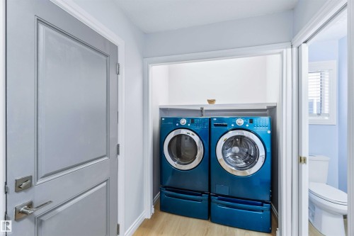 Washroom featuring light wood-style floors and separate washer and dryer - 115 Deer Ridge Drive, St. Albert, AB - Indoor Photo Showing Laundry Room