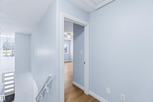 Hall featuring an upstairs landing and light wood-style flooring - 115 Deer Ridge Drive, St. Albert, AB - Indoor Photo Showing Other Room
