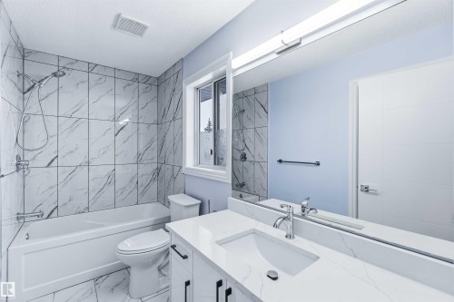 Bathroom featuring shower / washtub combination, vanity, and marble finish floors - 115 Deer Ridge Drive, St. Albert, AB - Indoor Photo Showing Bathroom