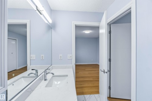 Bathroom with vanity, a textured ceiling, and light marble finish flooring - 115 Deer Ridge Drive, St. Albert, AB - Indoor Photo Showing Bathroom