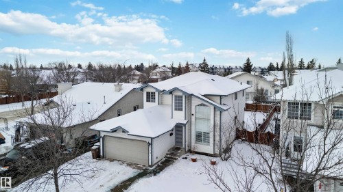 View of front of house with a garage and a residential view - 115 Deer Ridge Drive, St. Albert, AB - Outdoor