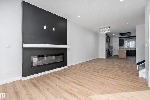 442 Crystal Creek Link, Leduc, AB - Indoor Photo Showing Living Room With Fireplace