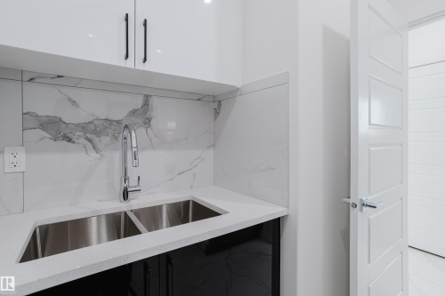 933 19 Avenue, Edmonton, AB - Indoor Photo Showing Kitchen With Double Sink