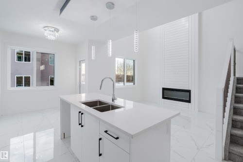 933 19 Avenue, Edmonton, AB - Indoor Photo Showing Kitchen With Double Sink