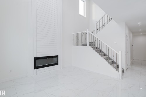 933 19 Avenue, Edmonton, AB - Indoor Photo Showing Other Room With Fireplace