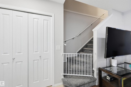 Stairway featuring a textured ceiling - 21017 60 Avenue, Edmonton, AB - Indoor
