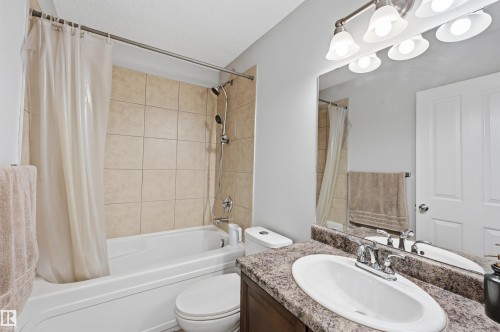 Full bathroom with vanity and shower / tub combo - 21017 60 Avenue, Edmonton, AB - Indoor Photo Showing Bathroom