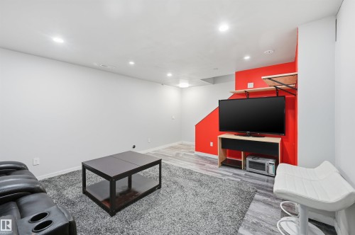 Recreation room with recessed lighting and light wood finished floors - 21017 60 Avenue, Edmonton, AB - Indoor