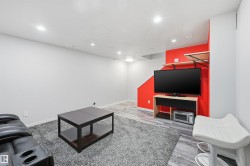 Recreation room with recessed lighting and light wood finished floors - 