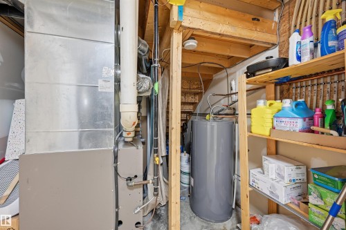 Utilities featuring heating unit and water heater - 21017 60 Avenue, Edmonton, AB - Indoor Photo Showing Basement