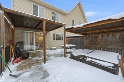 Snow covered patio featuring a wooden deck - 