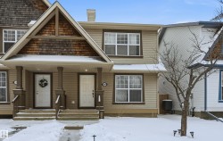 View of front of home featuring a porch and a chimney - 