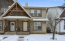 View of front of home featuring a porch and a chimney - 21017 60 Avenue, Edmonton, AB  - Outdoor With Facade 