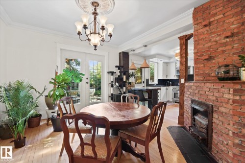 10838 126 Street, Edmonton, AB - Indoor Photo Showing Dining Room With Fireplace