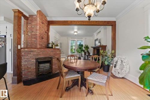 10838 126 Street, Edmonton, AB - Indoor Photo Showing Dining Room With Fireplace