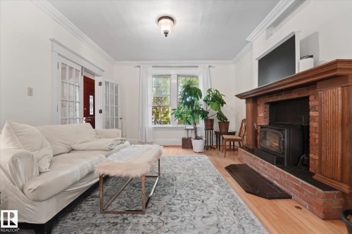 10838 126 Street, Edmonton, AB - Indoor Photo Showing Living Room With Fireplace