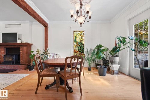 10838 126 Street, Edmonton, AB - Indoor Photo Showing Dining Room With Fireplace