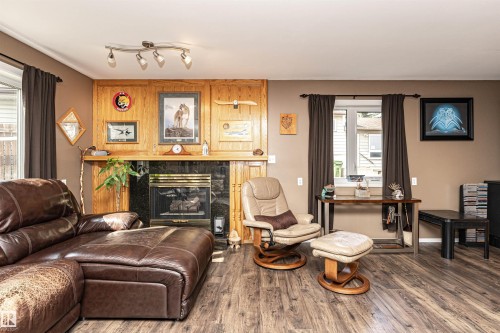 9007 102 Avenue, Morinville, AB - Indoor Photo Showing Living Room With Fireplace