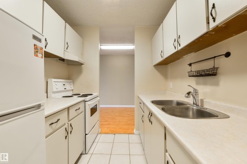 601 13910 Stony Plain Road, Edmonton, AB - Indoor Photo Showing Kitchen With Double Sink