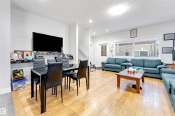 Living area featuring light wood finished floors, recessed lighting, and stairs - 