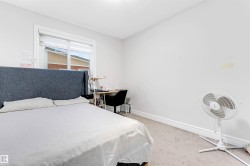 Carpeted bedroom with baseboards - 