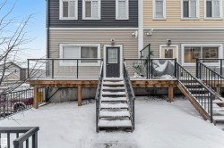 Snow covered property entrance with a deck - 