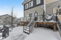 Snow covered property entrance featuring a deck - 