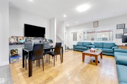 Living room with light wood-style floors and recessed lighting - 
