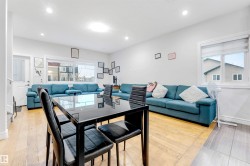 Dining area with light wood-type flooring and recessed lighting - 