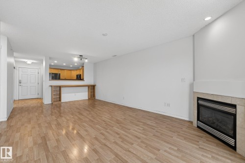 420 12110 106 Avenue, Edmonton, AB - Indoor Photo Showing Living Room With Fireplace