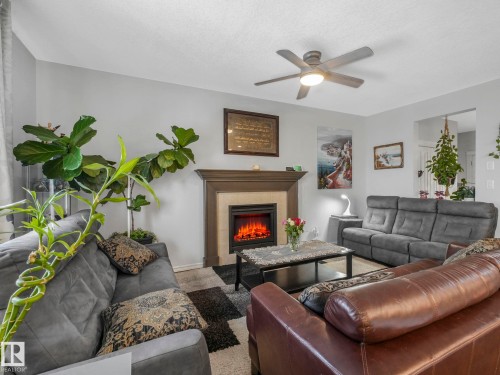 540 59 Street Sw, Edmonton, AB - Indoor Photo Showing Living Room With Fireplace