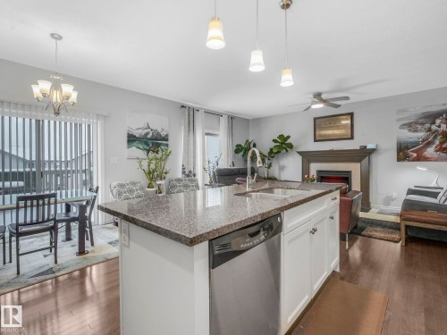 540 59 Street Sw, Edmonton, AB - Indoor Photo Showing Kitchen With Fireplace