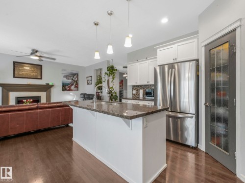 540 59 Street Sw, Edmonton, AB - Indoor Photo Showing Kitchen With Fireplace With Upgraded Kitchen