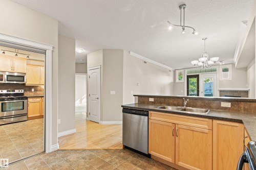112 12408 15 Avenue, Edmonton, AB - Indoor Photo Showing Kitchen With Double Sink