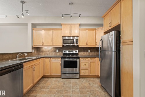 112 12408 15 Avenue, Edmonton, AB - Indoor Photo Showing Kitchen With Double Sink
