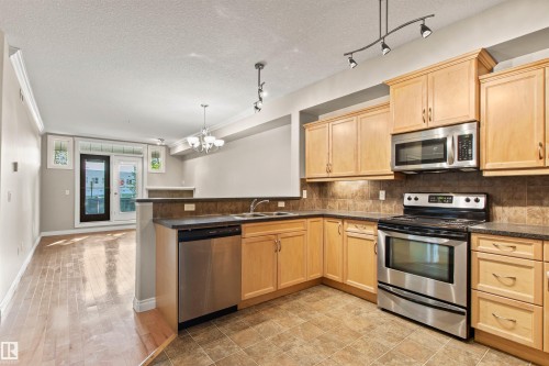 112 12408 15 Avenue, Edmonton, AB - Indoor Photo Showing Kitchen With Double Sink